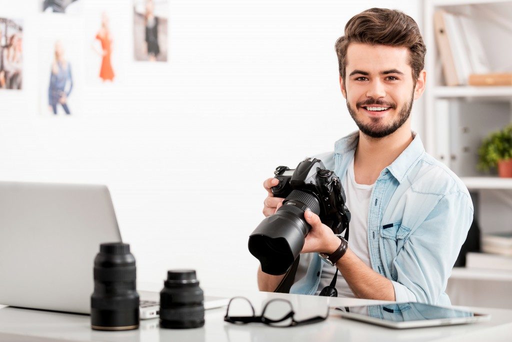 Young photographer smiling