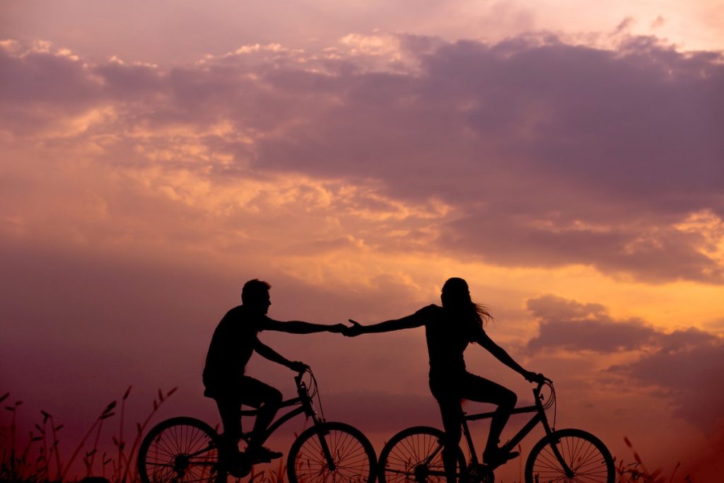 two people riding bikes