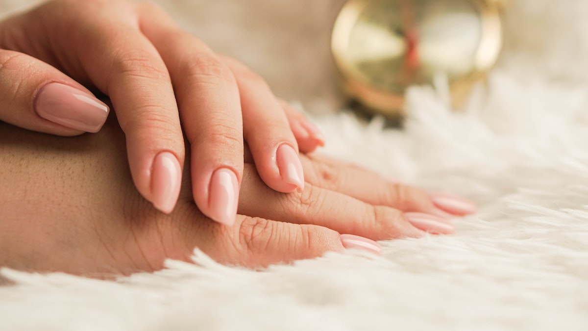 woman with freshly manicured nails
